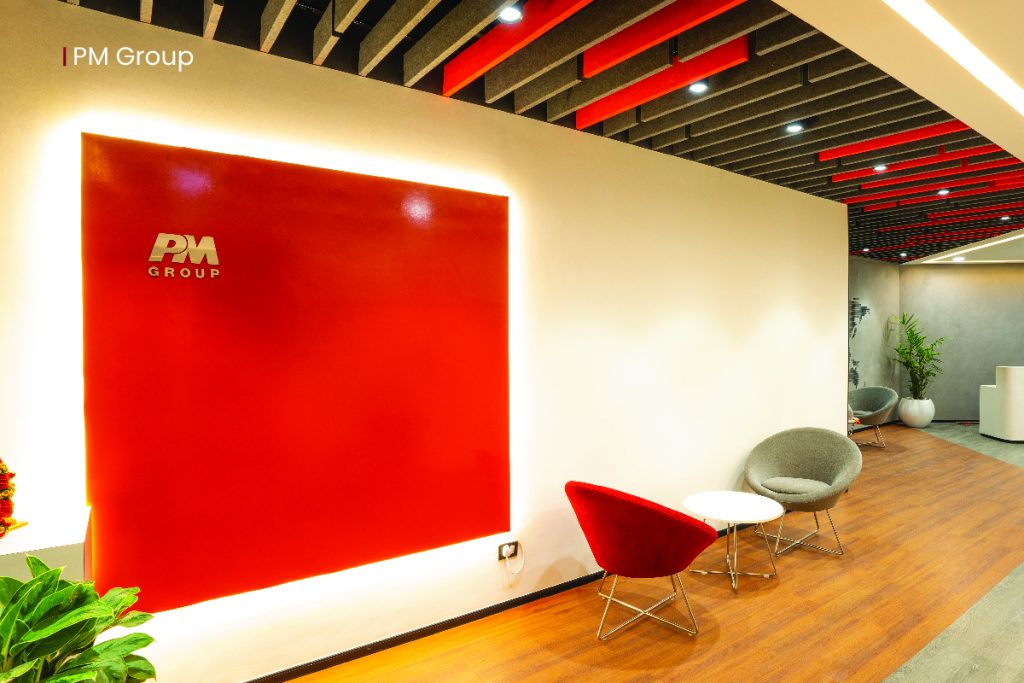 PM Group workspace, built by Exotic Innovations. Red is a bold color in color psychology, as it  immediately grabs one's attention